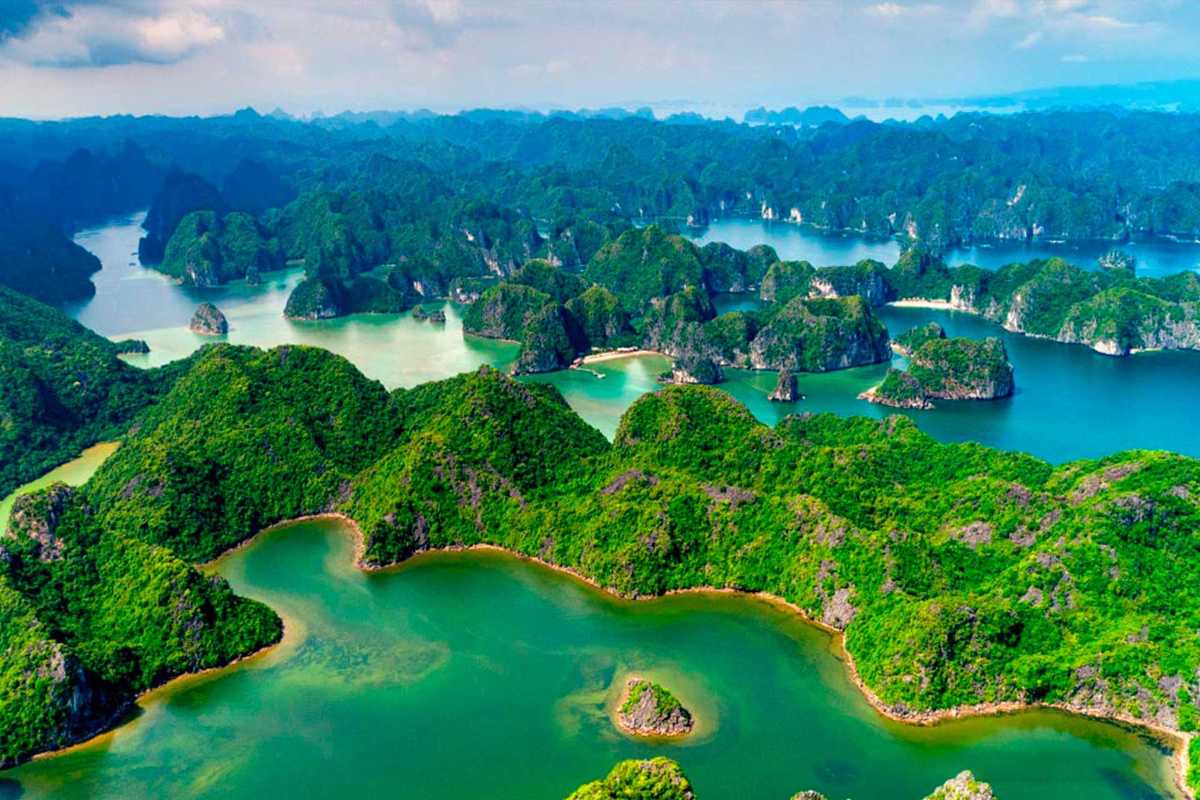 Floating Village Near Cap La Island Bai Tu Long Bay Traditional floating village houses near limestone islands in Bai Tu Long Bay close to Cap La Island