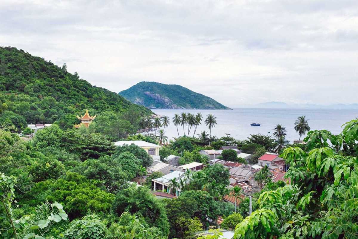Aerial Panorama of Cham Islands with Clear Waters and Palm Trees Bird's eye view of the Cham Islands featuring turquoise waters, sandy beaches, and palm trees