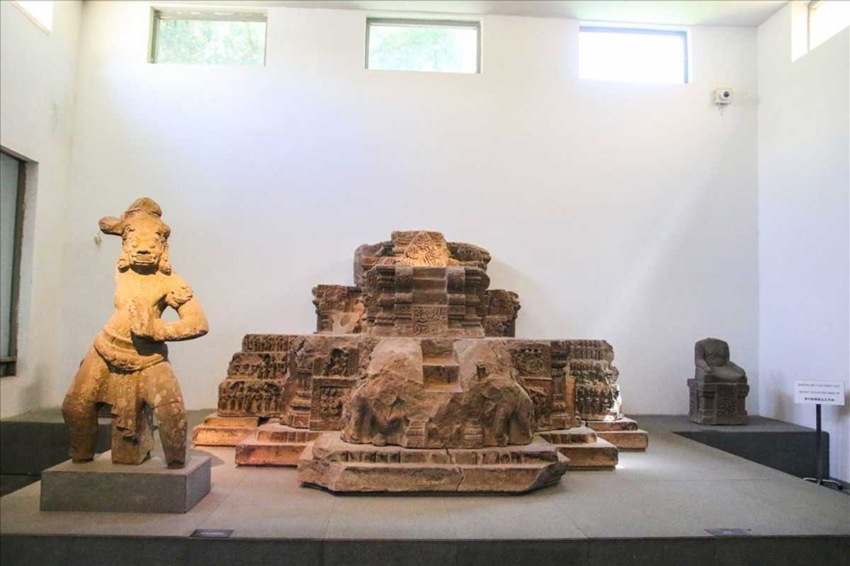 Cham Sculpture Museum Da Nang ancient altar with guardian statue Cham Sculpture Museum Da Nang displays an ancient altar with a guardian statue, rich with detailed carvings and historical value