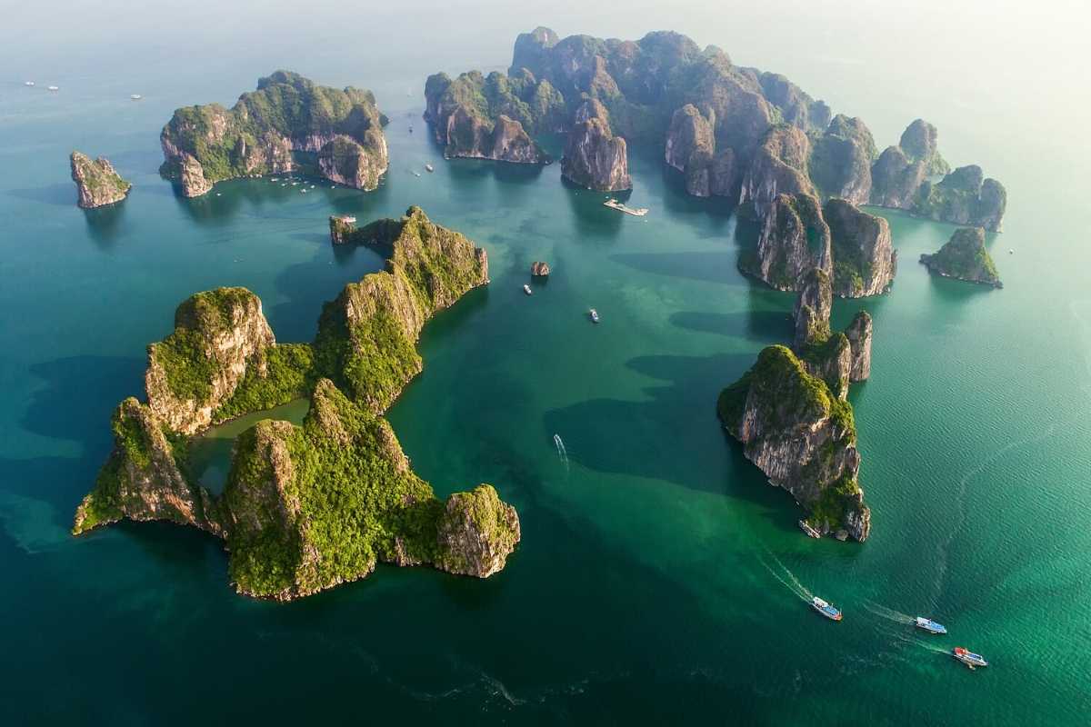 Cho Da Islet Halong Bay aerial bay and islands Aerial shot of Halong Bay with Cho Da Islet among numerous small islands and calm blue waters.