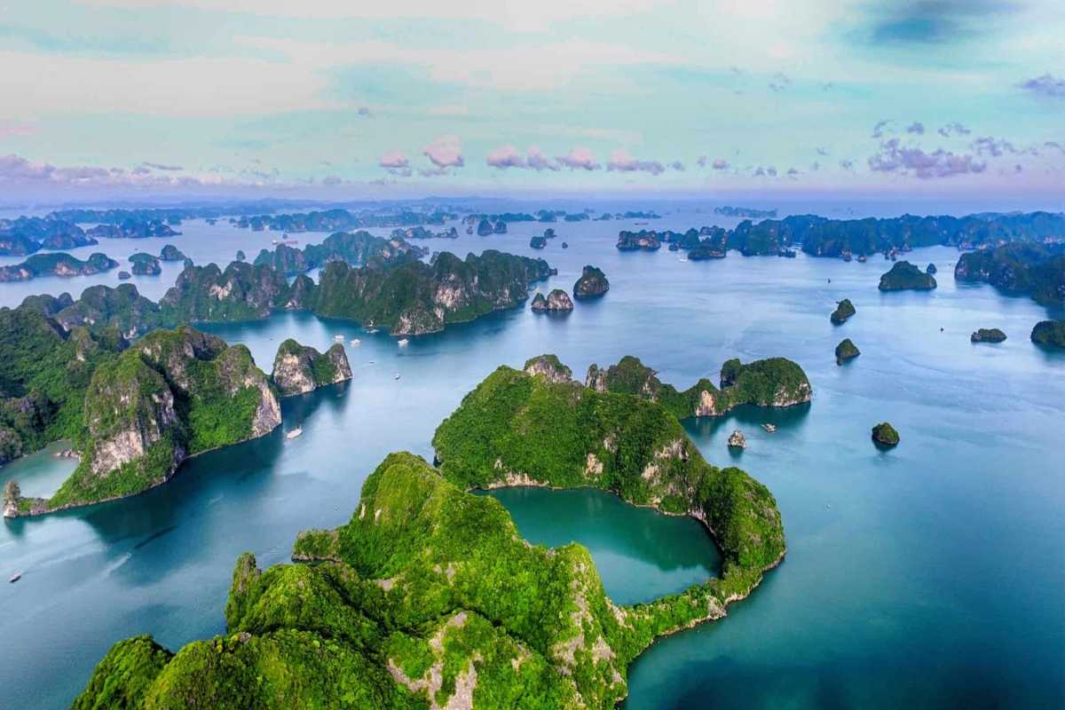 Cho Da Islet Halong Bay aerial island cluster view Aerial view of Cho Da Islet Halong Bay showing multiple green limestone islands scattered across calm turquoise waters.