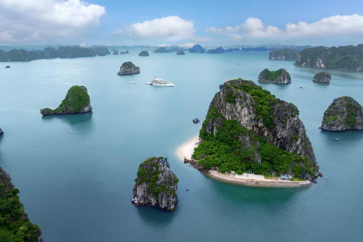 Cho Da Islet Halong Bay limestone karst formation Limestone karst formation on Cho Da Islet Halong Bay with green vegetation and clear waters.