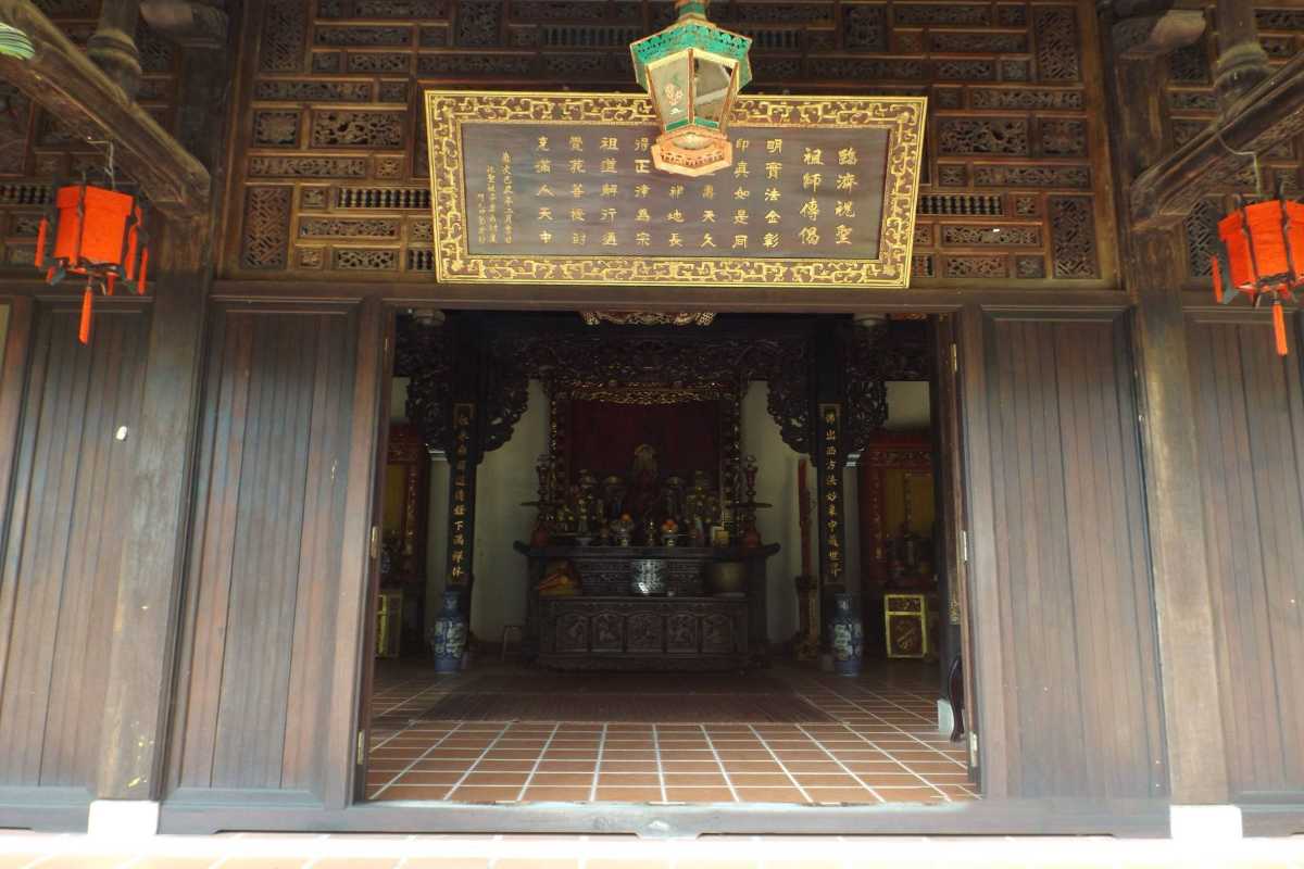 Exterior View of Chuc Thanh Pagoda Main Hall Traditional Vietnamese roof with decorative eaves and wooden beams at the main hall of Chuc Thanh Pagoda