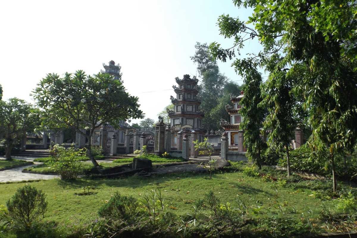 Memorial Towers at Chuc Thanh Pagoda Hoi An Traditional Vietnamese memorial towers surrounded by lush greenery at Chuc Thanh Pagoda in Hoi An