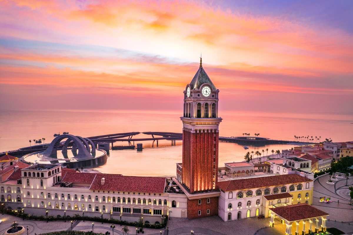 Clock Tower Phu Quoc Lit Up at Night Nighttime lighting showcasing Clock Tower Phu Quoc by the sea with vibrant colors