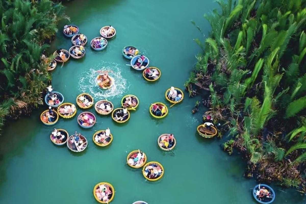 Cluster of Basket Boats on Calm Waterways Group of tourists enjoying colorful basket boats in calm water channels of Cam Thanh Coconut Village