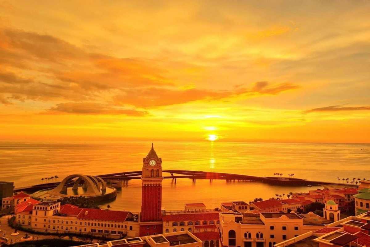 Clock Tower Phu Quoc and Vibrant Coastal Buildings Vibrant coastal buildings surrounding Clock Tower Phu Quoc at sunset