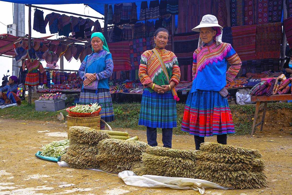Coc Ly Market Sapa ethnic vendors mountain herbs Coc Ly Market Sapa ethnic vendors in traditional dresses selling mountain herbs and local produce at colorful stalls.