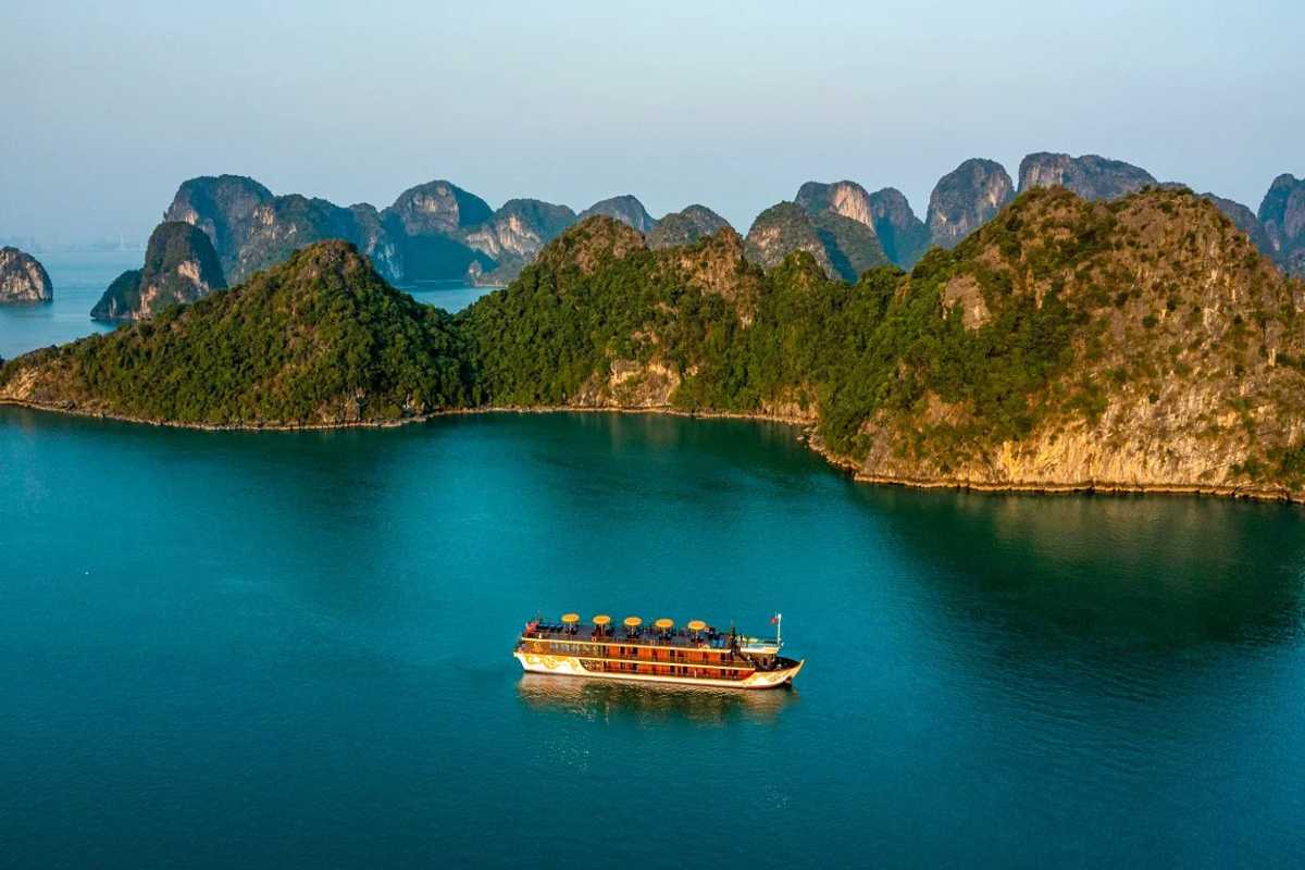 Cong Do Island Bai Tu Long Bay aerial limestone islets view Aerial view capturing the limestone islets and emerald waters surrounding Cong Do Island in Bai Tu Long Bay