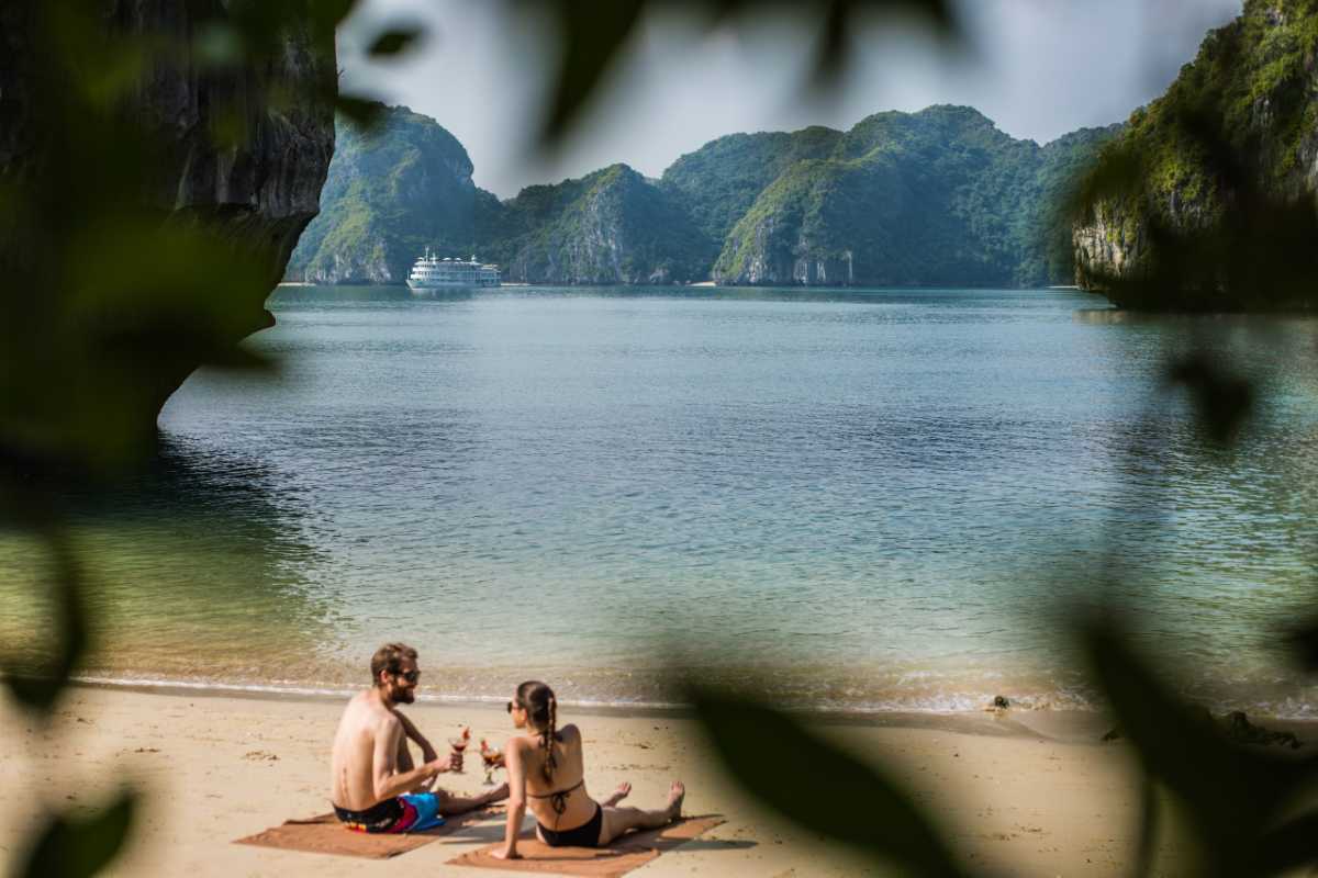 Cong Do Island Bai Tu Long Bay floating fishing village Floating fishing village with boats and houses nestled among limestone cliffs on Cong Do Island in Bai Tu Long Bay