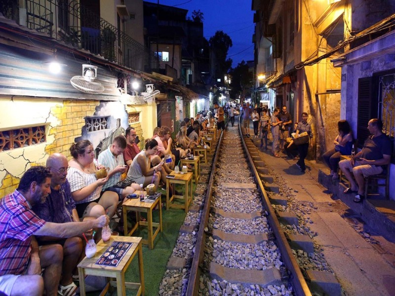 Cozy café on Hanoi Train Street with vibrant decorations