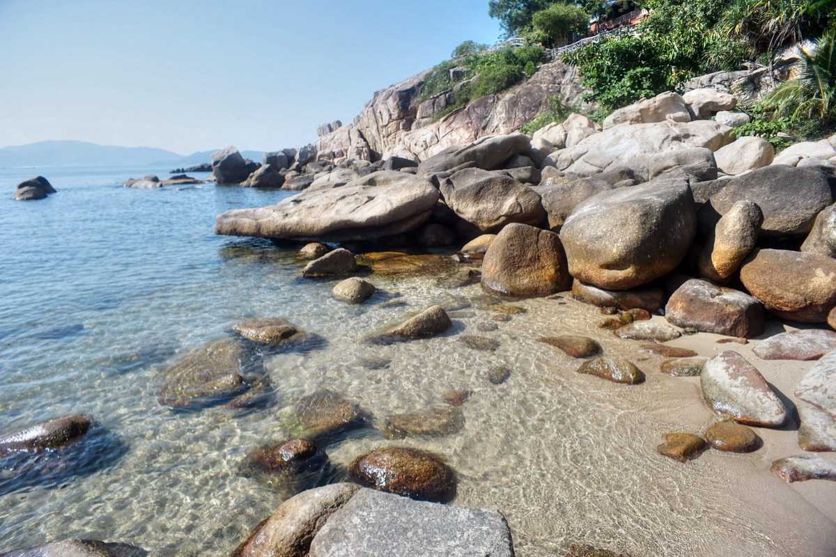 Da Chong Wharf Greenery and Granite Rocks Nha Trang Green foliage with granite rock formations near the coast at Da Chong Wharf, Nha Trang