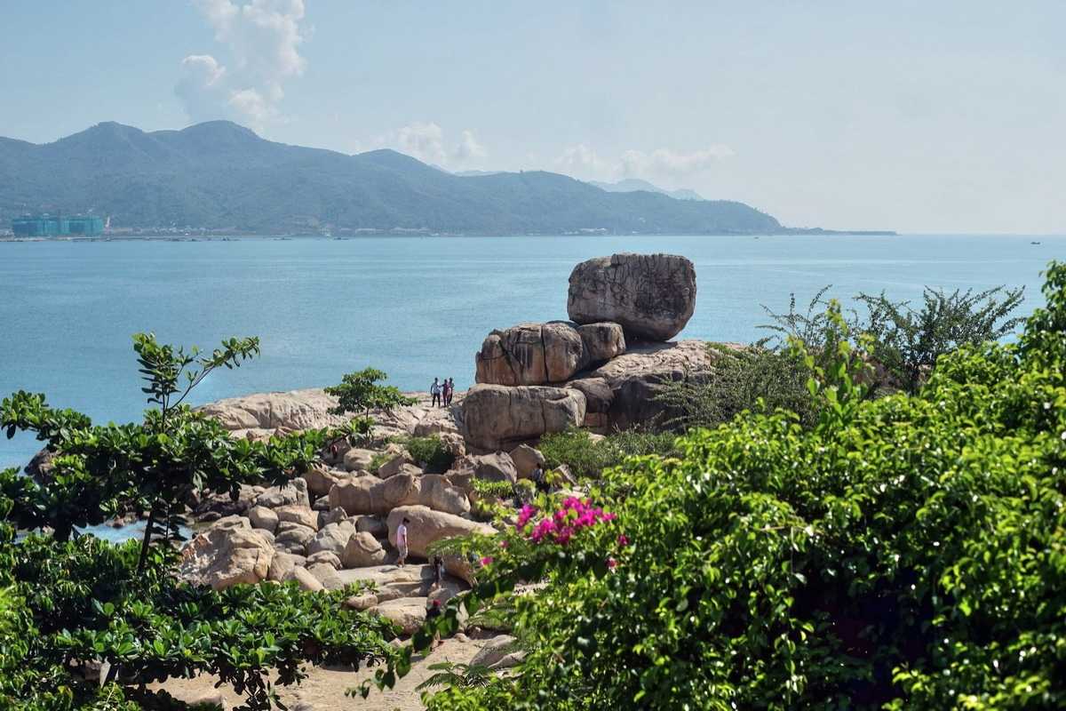Da Chong Wharf Unique Red Rock Formation Nha Trang Unique red granite rock formation surrounded by clear water at Da Chong Wharf, Nha Trang