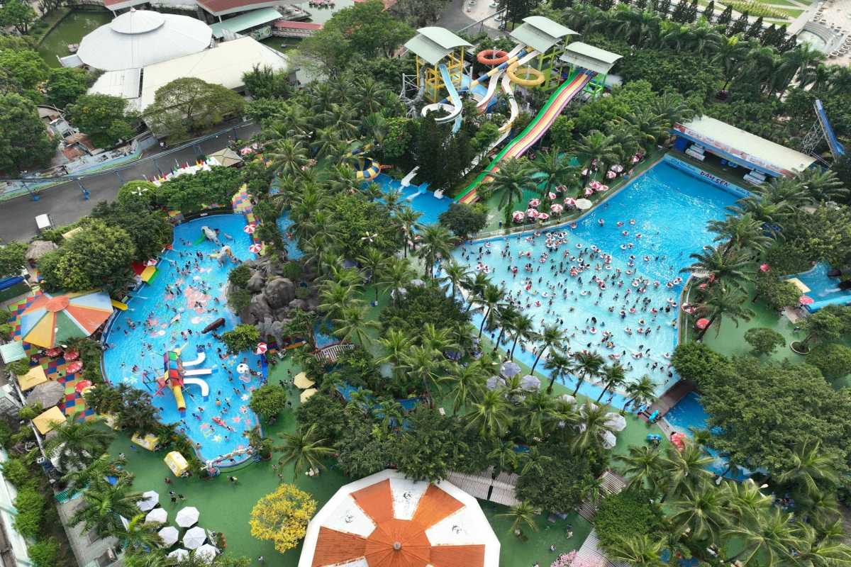 Aerial View of Water Slides and Pools at Dam Sen Overhead view showing multiple water slides, pools, and lush greenery at Dam Sen Water Park