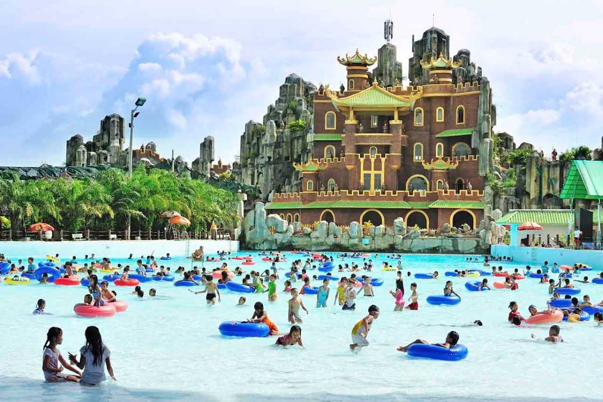 Wave Pool Filled with Families at Dam Sen Water Park Crowded wave pool with children and adults enjoying the waves and floating tubes at Dam Sen Water Park