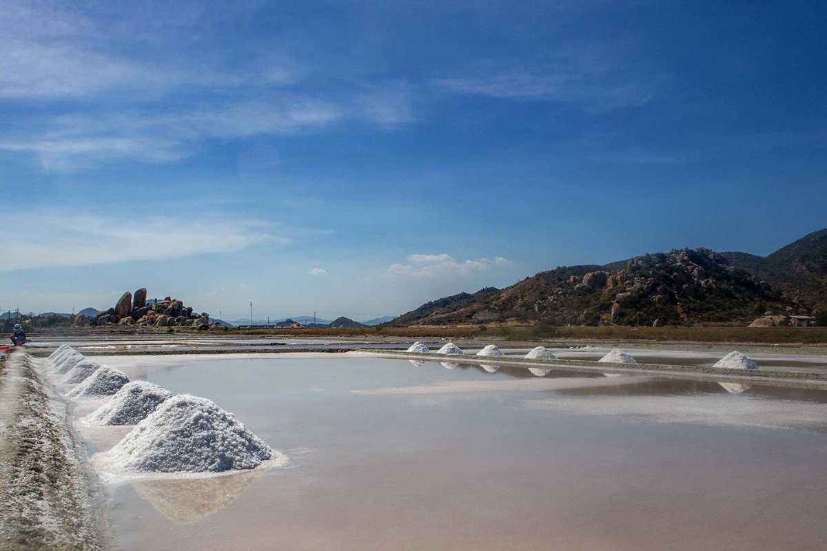 Dam Vua Salt Fields Salt Art and Harvesting Salt workers creating artistic patterns during harvesting at Dam Vua Salt Fields