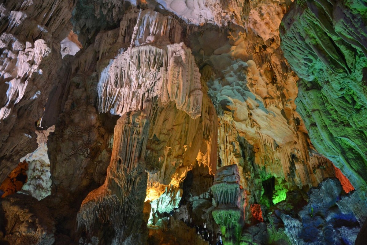 Dau Go Cave with illuminated stalactites and stalagmites formations in Ha Long Bay