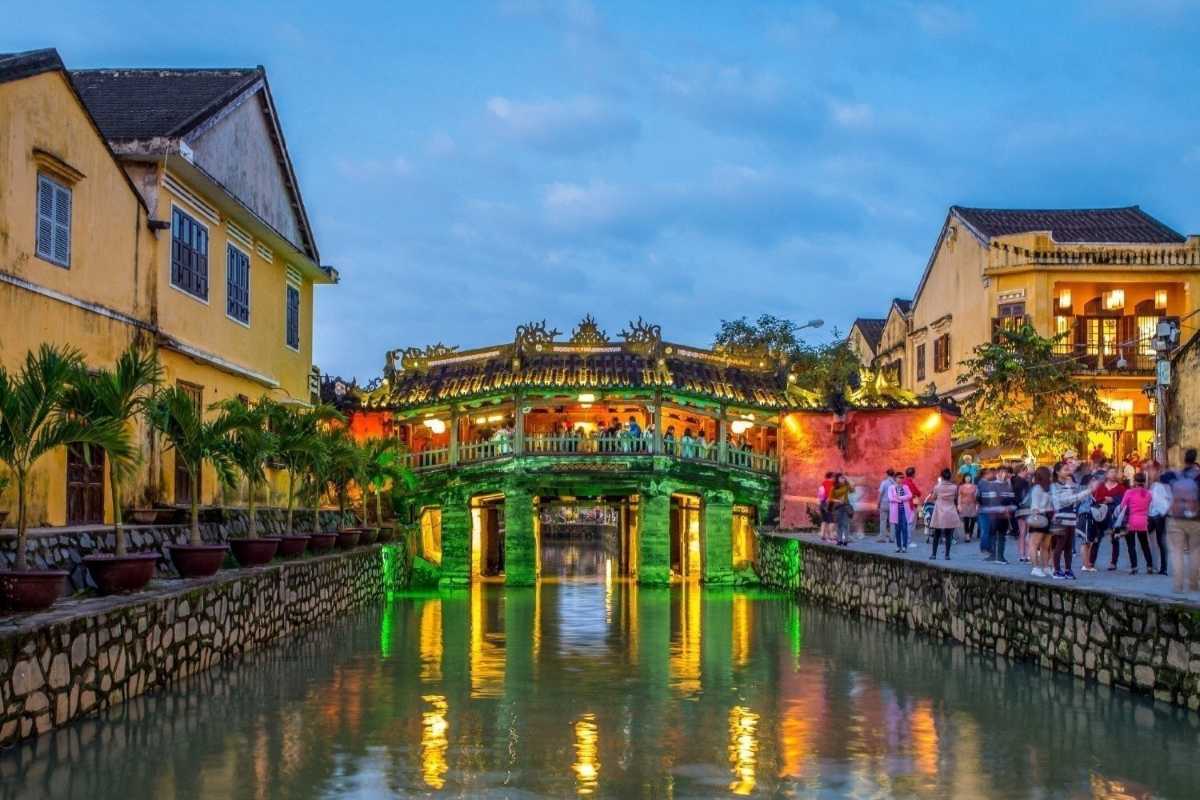 Japanese Bridge Hoi An in daylight The Japanese Bridge Hoi An with clear water flowing beneath and the iconic old town in daylight