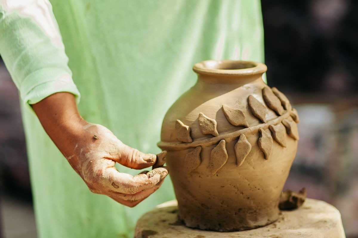 Handmade Decorative Pottery with Leaf Motifs Close-up of handmade pottery decorated with leaf patterns at Thanh Ha Pottery Village, Hoi An