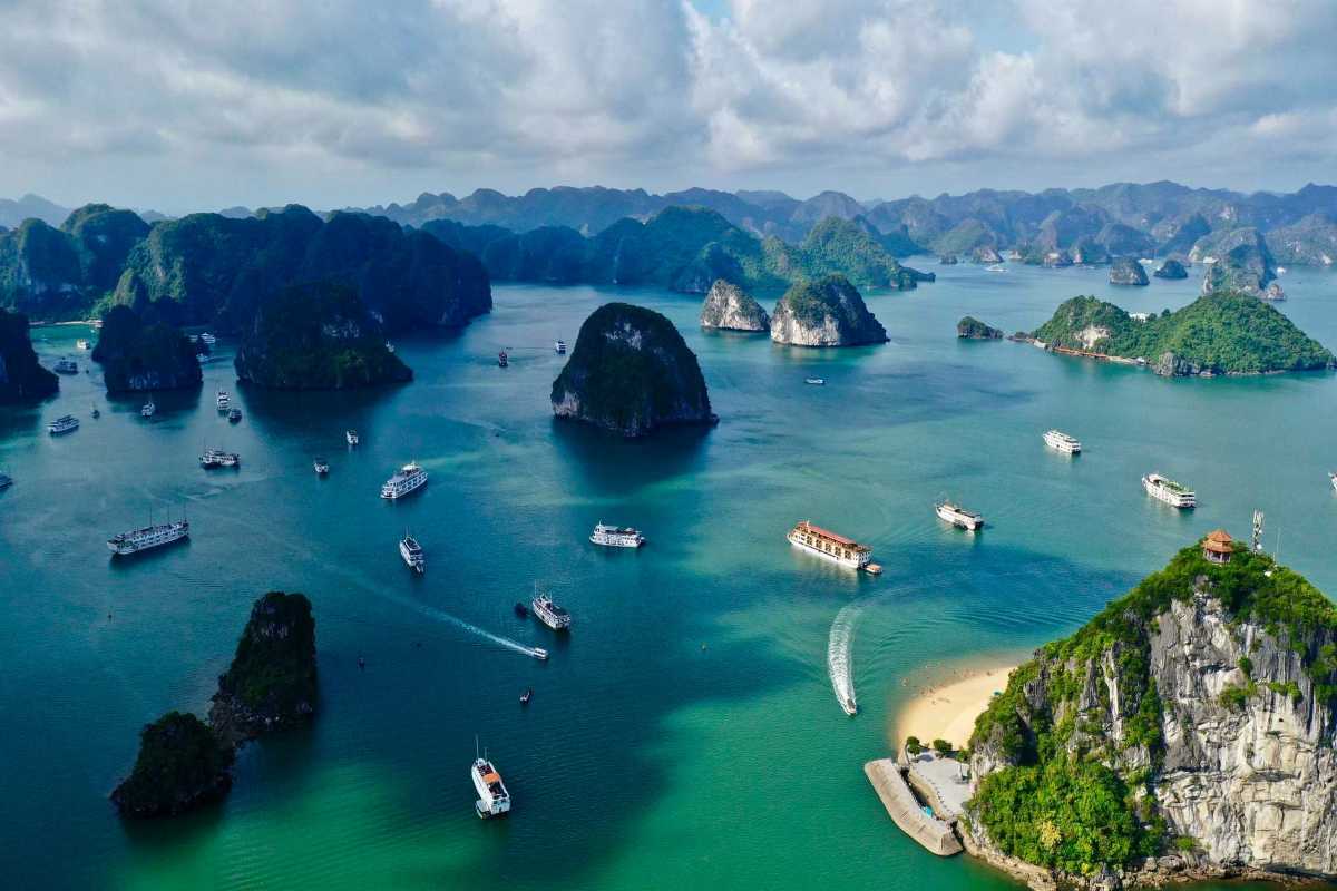 Dinh Huong Islet Halong Bay limestone islands at dawn Dawn breaks over limestone islands of Dinh Huong Islet Halong Bay with calm waters and soft light