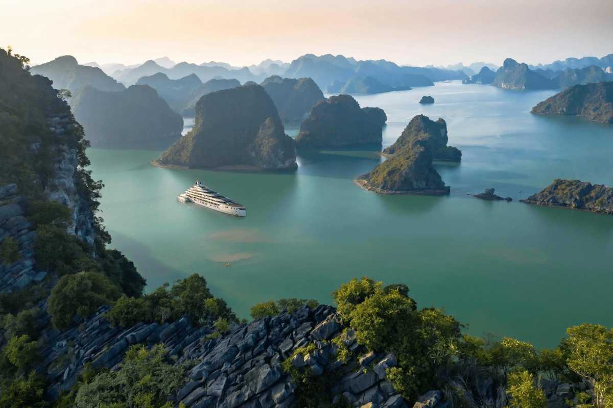 Dinh Huong Islet Halong Bay limestone islets aerial view Aerial view of limestone islets and boats in Dinh Huong Islet Halong Bay