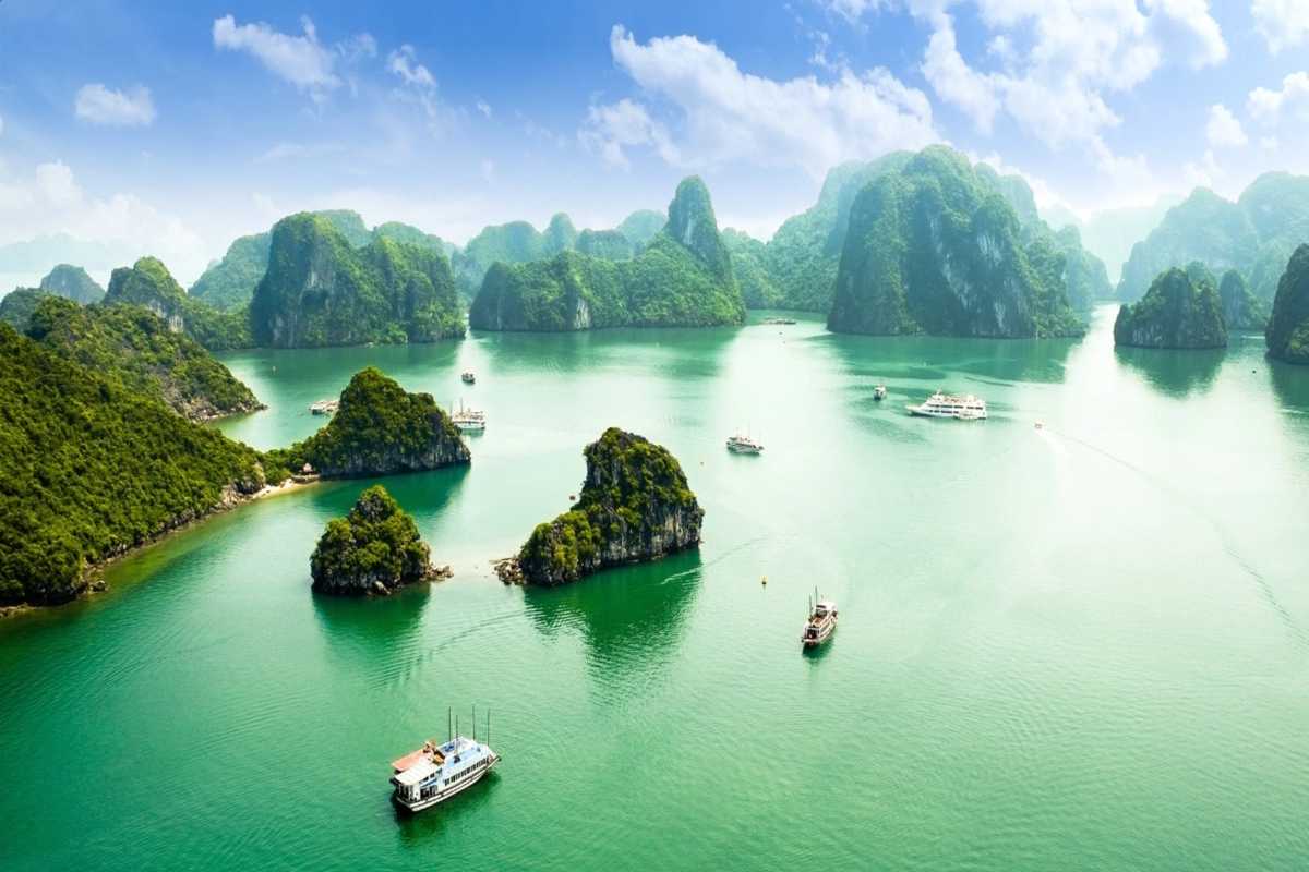 Dinh Huong Islet Halong Bay limestone karsts aerial view Aerial view showing limestone karsts and cruise boats at Dinh Huong Islet Halong Bay