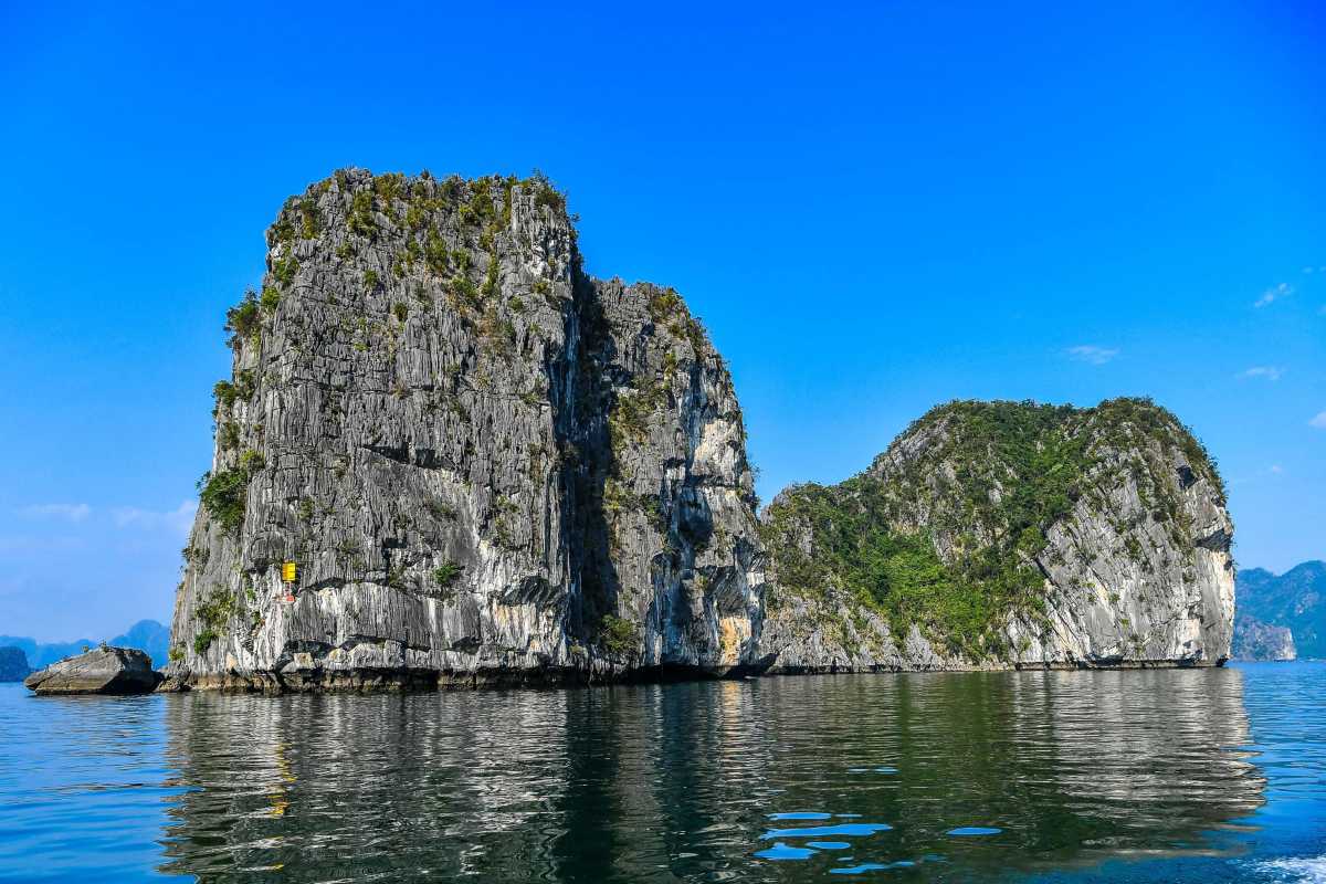 Dinh Huong Islet Halong Bay limestone pillar rock Limestone pillar rock formation standing prominently at Dinh Huong Islet Halong Bay