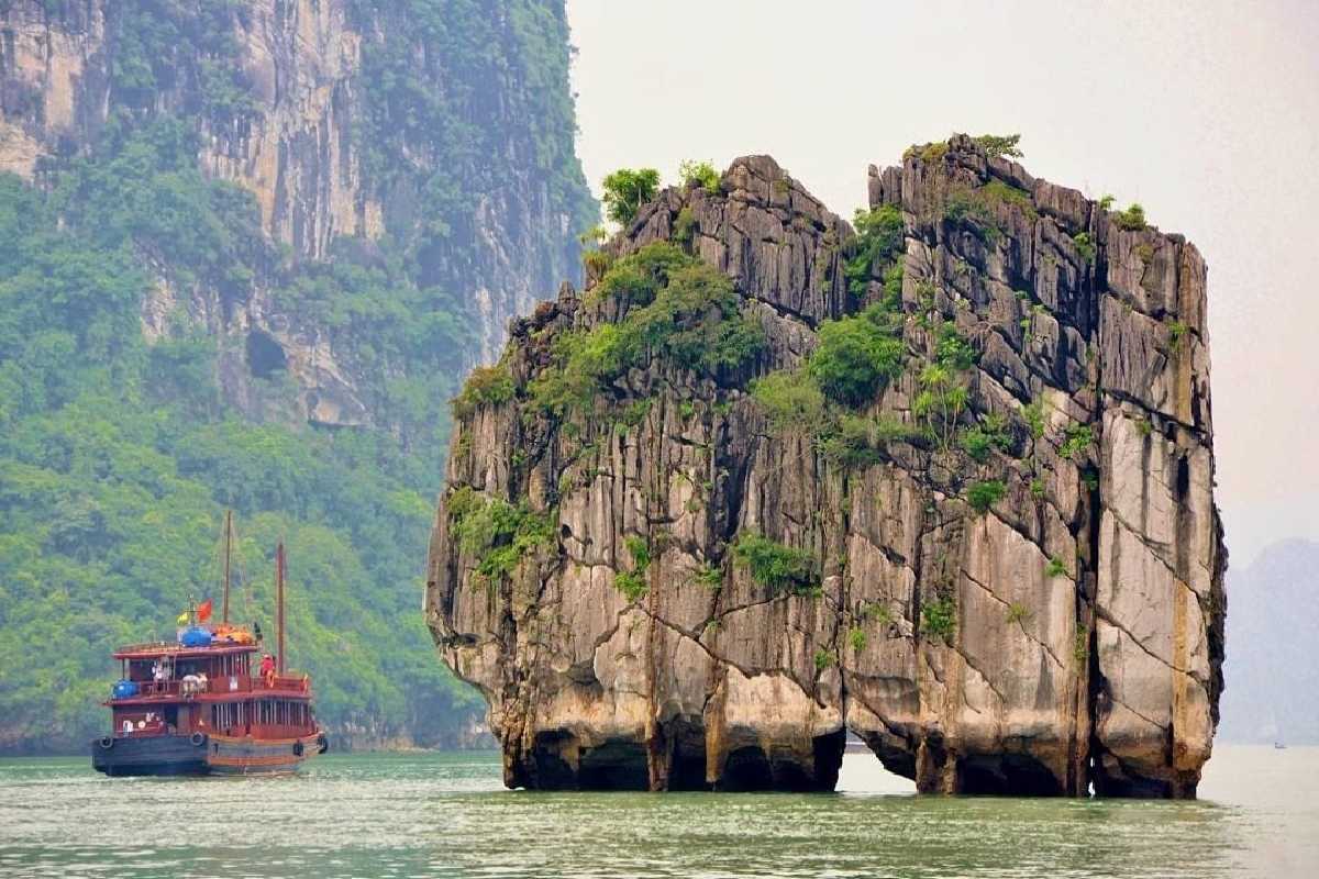 Dinh Huong Islet Halong Bay scenic limestone bay Scenic limestone bay view with boats near Dinh Huong Islet Halong Bay