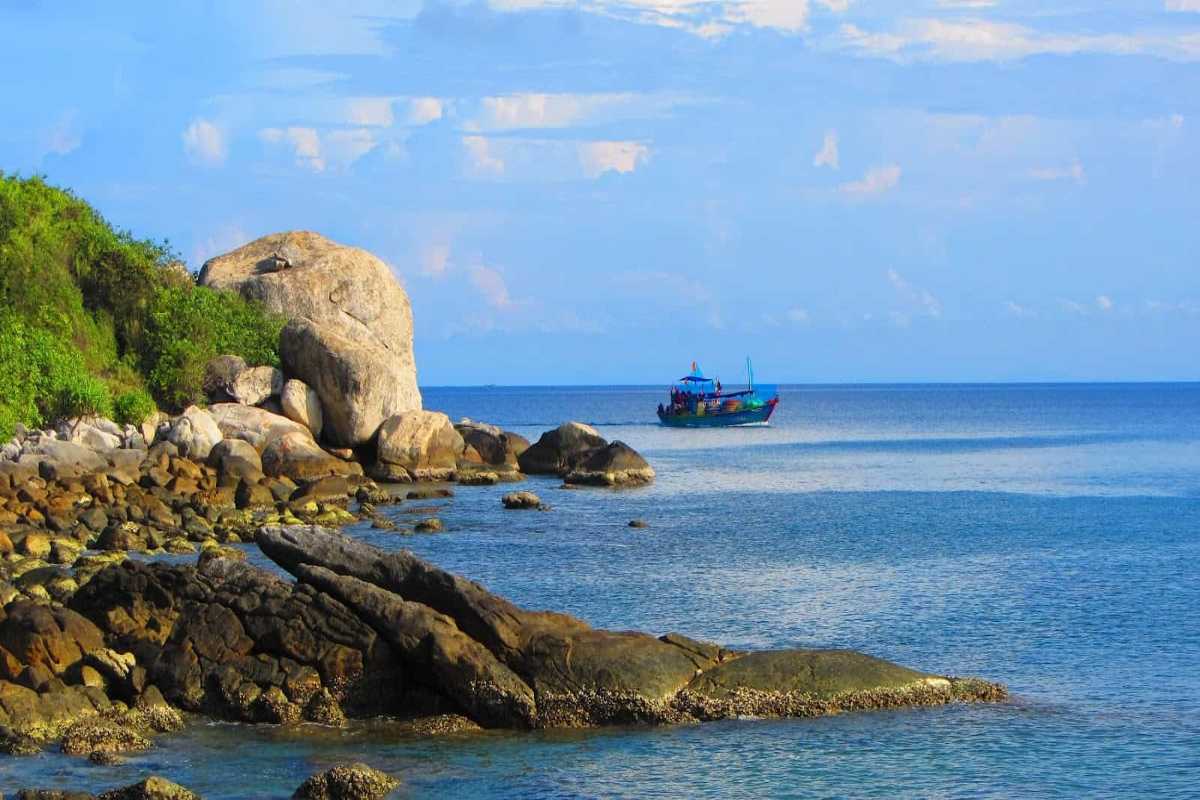 Dock and Ferries at Nha Phu Lagoon Nha Trang Docked ferries and boats at the pier of Nha Phu Lagoon Nha Trang with tropical surroundings