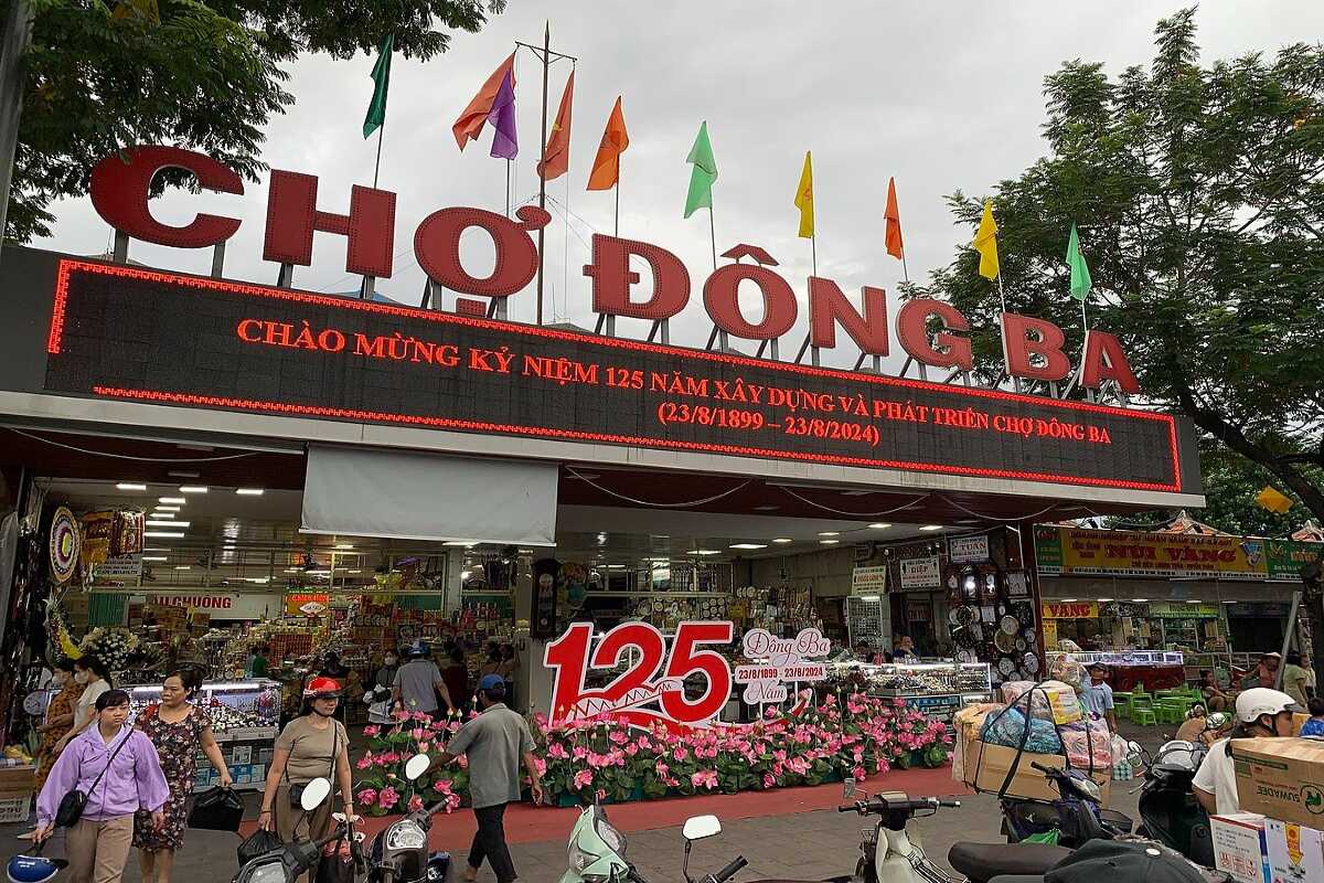 Main Entrance of Dong Ba Market Hue on 125th Anniversary Main entrance to Dong Ba Market in Hue decorated for 125th anniversary, bustling with visitors and vendors