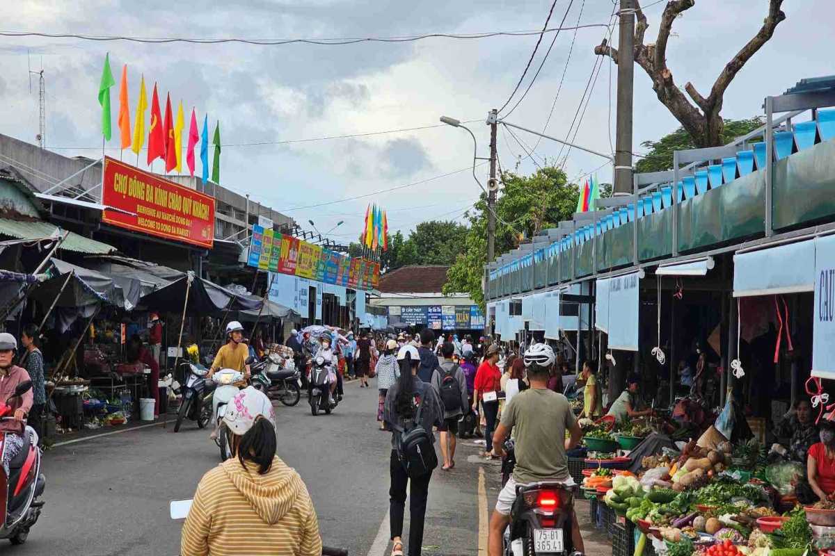 Fresh Produce Section at Dong Ba Market Hue Dong Ba Market's fresh produce section is bustling with shoppers, motorbikes, and colorful local produce