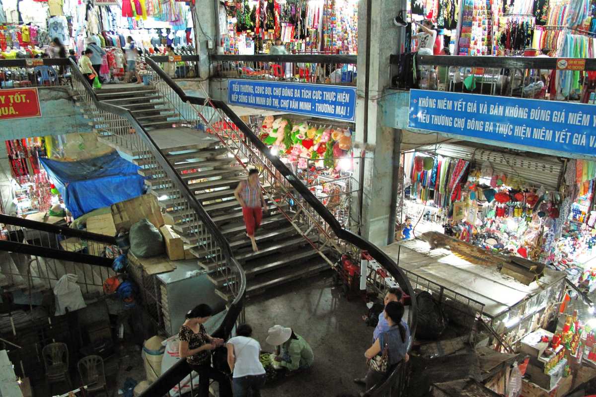 Main Staircase and Interior of Dong Ba Market Hue The main staircase at Dong Ba Market shows busy shoppers, market stalls, and the lively market interior