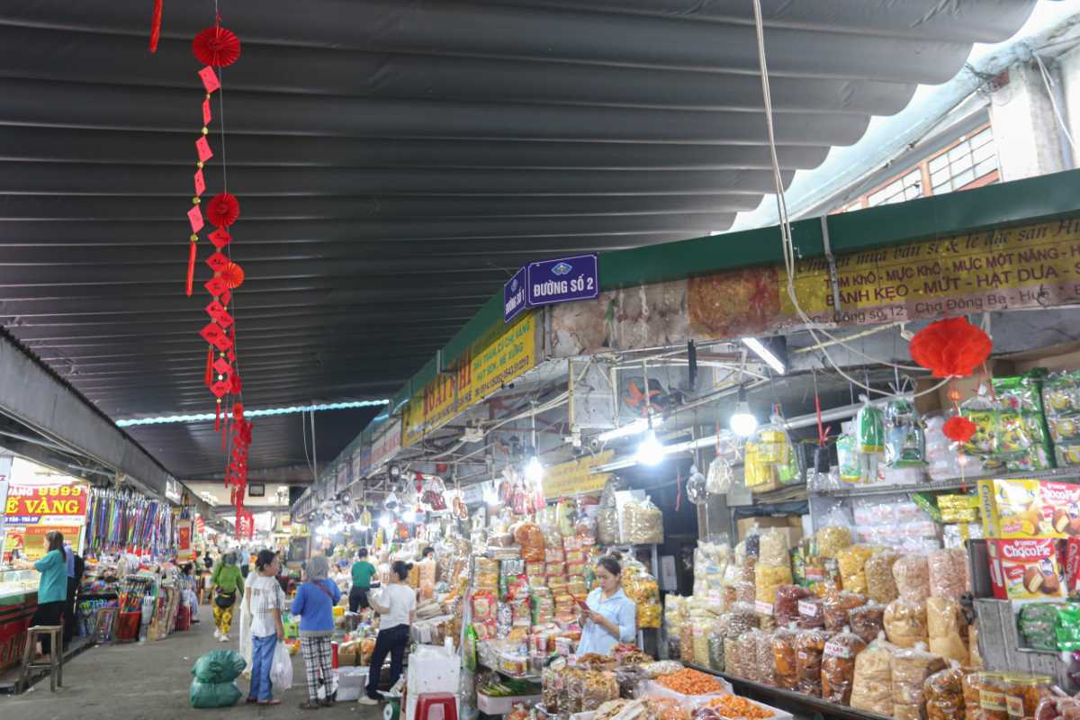 Snack and Dried Food Aisle at Dong Ba Market Hue Shoppers explore aisles filled with packaged snacks, dried foods, and local treats at Dong Ba Market