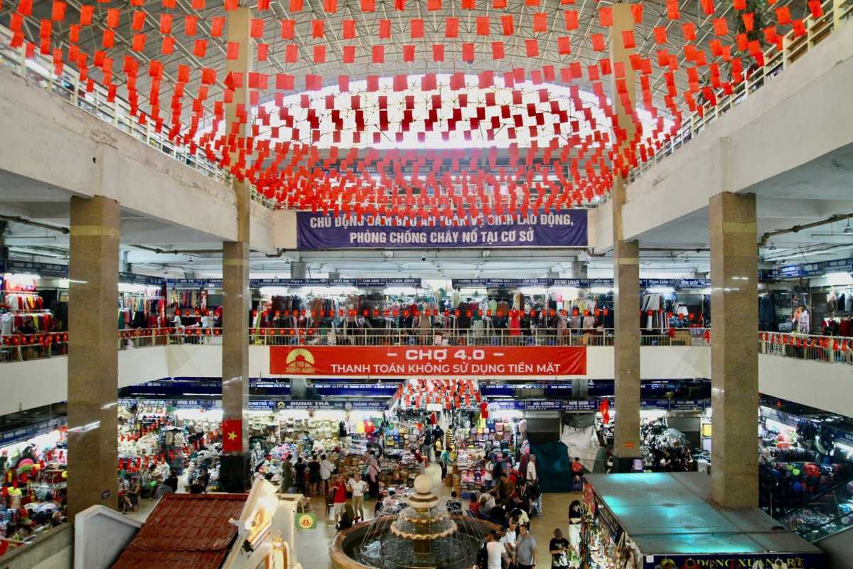 Dong Xuan Market Clothing and Accessories Stalls View of clothing and accessories stalls inside Dong Xuan Market bustling with customers.