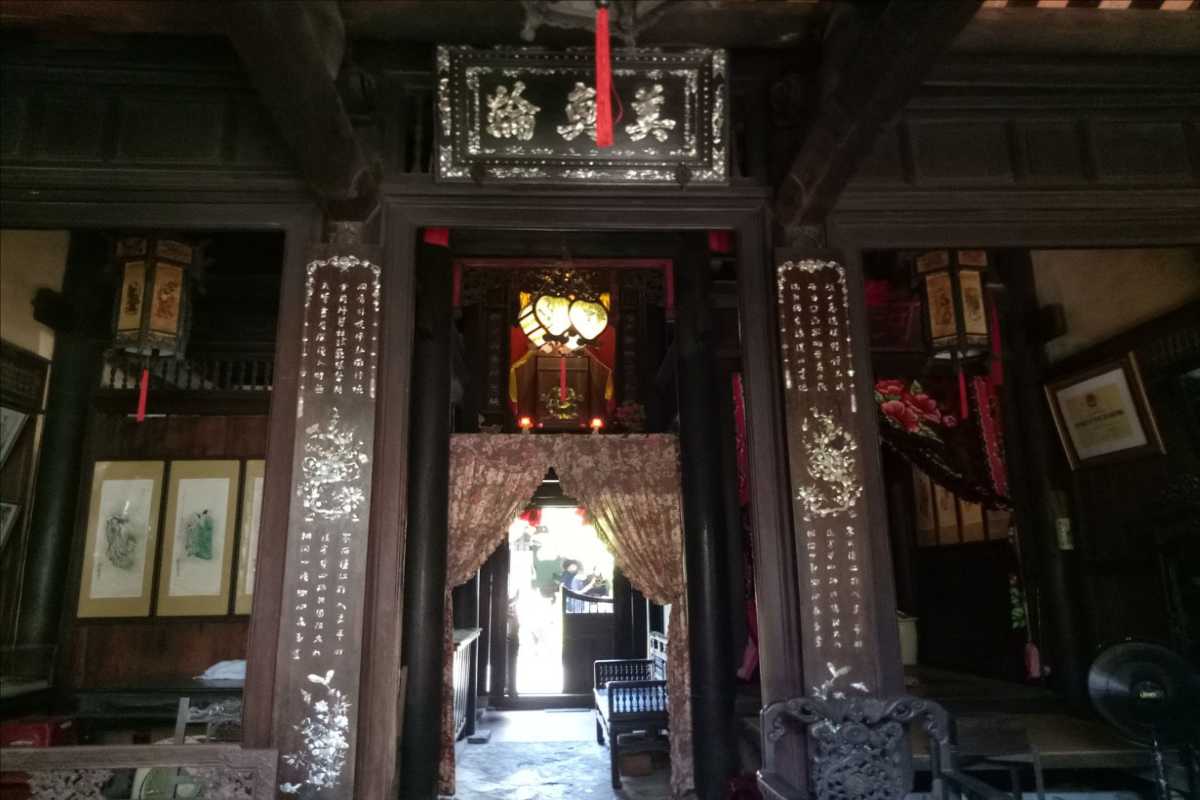 Traditional Entrance of Duc An Old House Hoi An Entrance view of Duc An Old House with traditional wooden architecture and decorative panels.