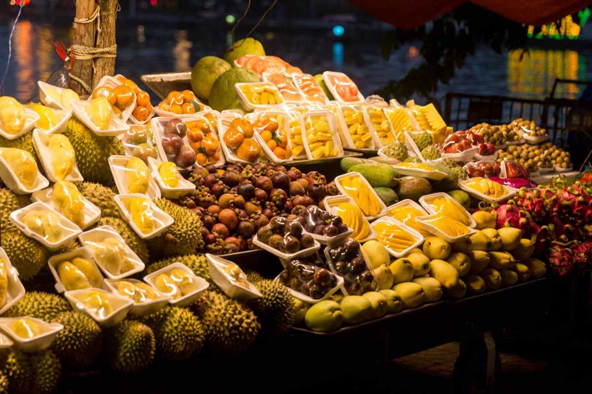 Duong Dong Night Market vibrant fruit stalls Colorful fresh tropical fruits displayed at Duong Dong Night Market Phu Quoc offering local seasonal varieties