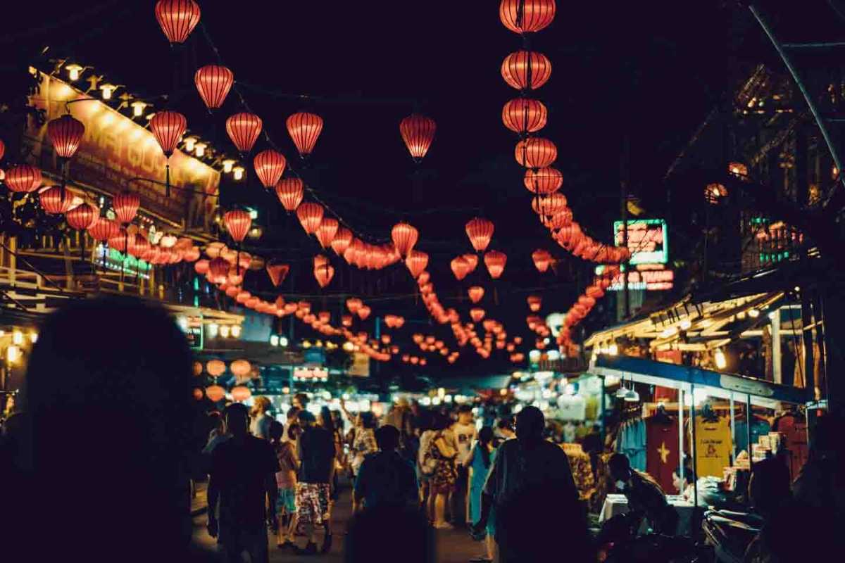 Night market street scene at Duong Dong Phu Quoc Busy night market street filled with locals and tourists shopping and dining at Duong Dong Night Market Phu Quoc