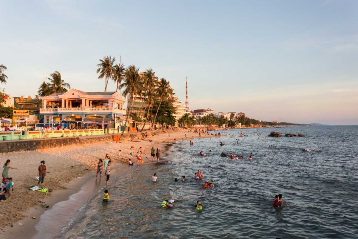 Duong Dong Town Beachfront with Sunset Visitors Sunset scene at Duong Dong Town beach with visitors enjoying the warm water and sandy shore