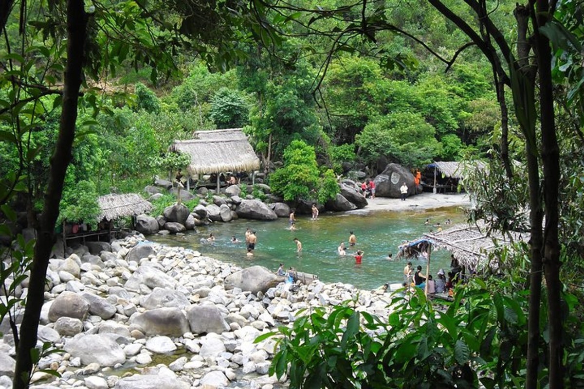 Natural pools at Elephant Springs Hue surrounded by lush greenery