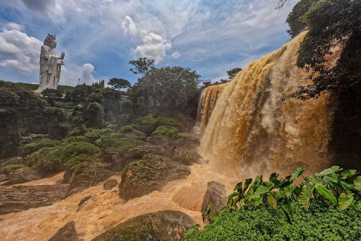 Elephant Waterfall Da Lat rocky terrain and falls Elephant Waterfall Da Lat flowing over rugged rocky terrain with green moss and vegetation clinging to the rocks