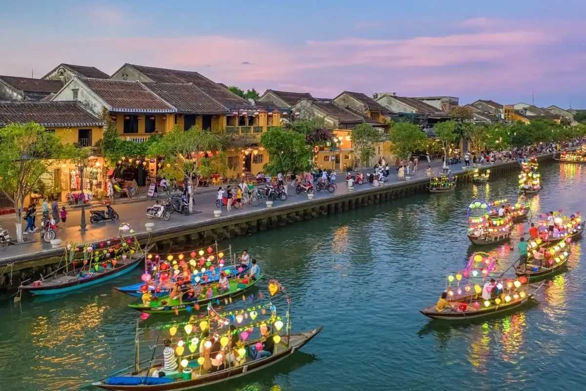 Evening Boat Festival on Thu Bon River Nighttime festival with illuminated boats on Thu Bon River in Hoi An