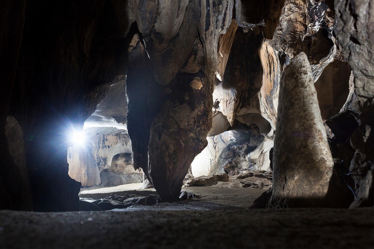 Interior view of Trung Trang Cave featuring natural limestone formations on Cat Ba Island.