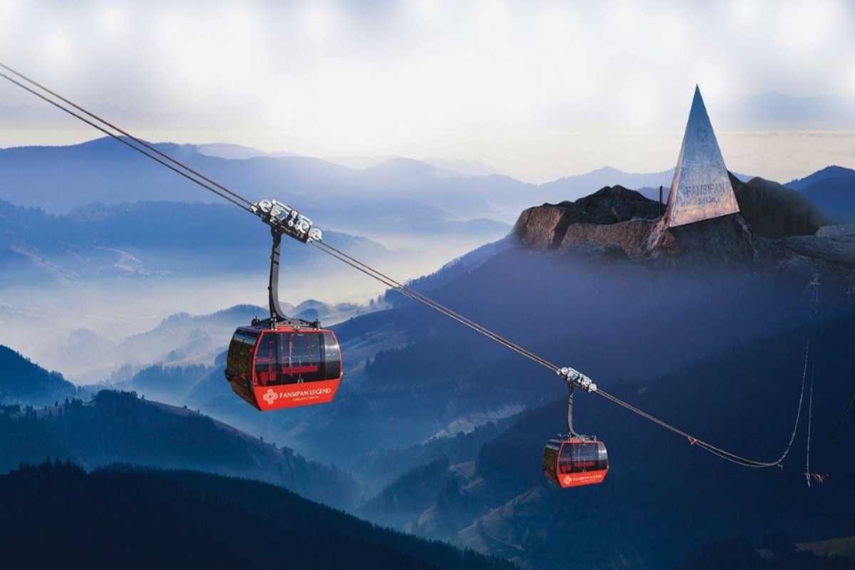 Fansipan Mountain Sapa cable car panoramic journey Fansipan Mountain Sapa cable car glides over misty forested slopes towards the pyramid summit marker at high altitude