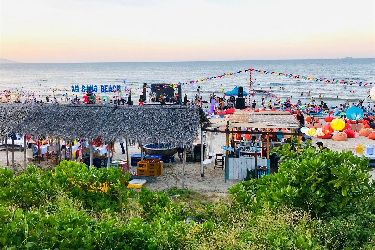 Festive atmosphere at An Bang Beach Hoi An with colorful decorations and visitors