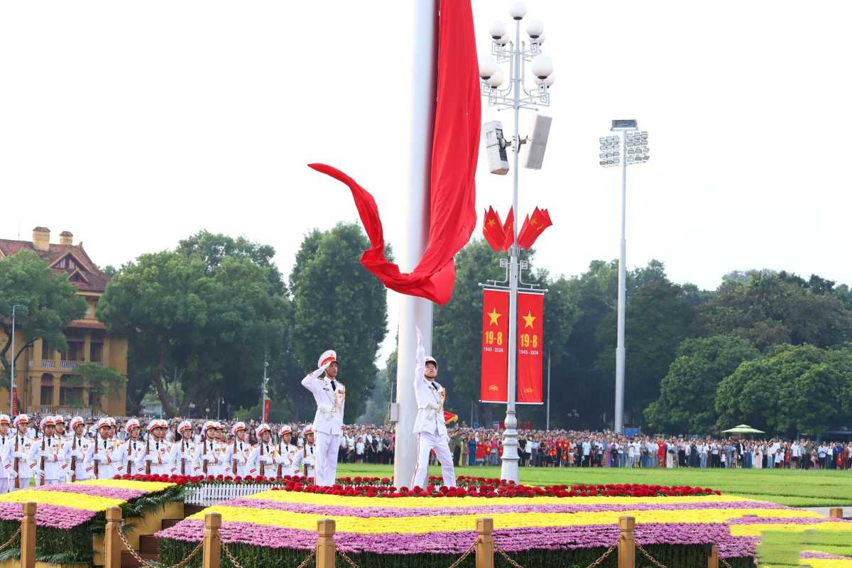 Flag Raising Ceremony at Ba Dinh Square Hanoi Flag-raising ceremony at Ba Dinh Square Hanoi, vibrant red flags