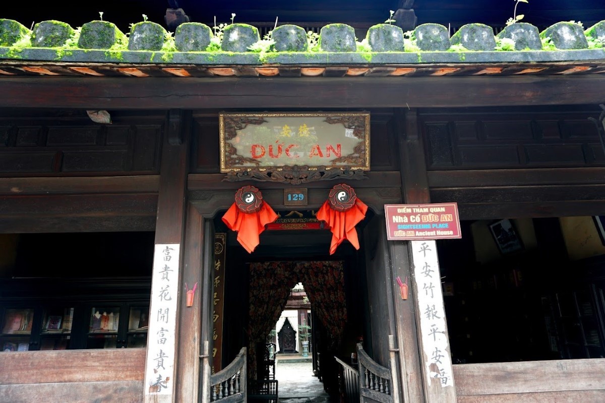 The main entrance of Duc An Old House in Hoi An, showcasing traditional Vietnamese architecture.