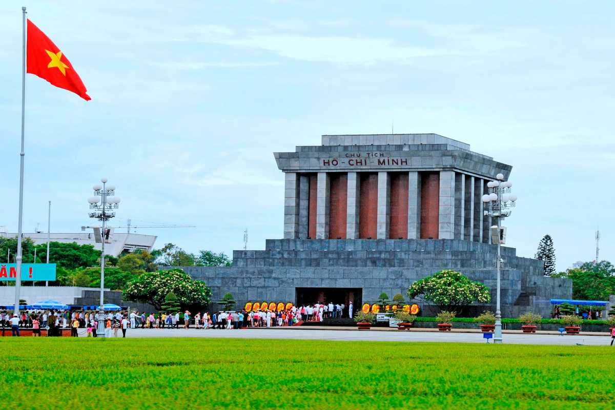 Ho Chi Minh Mausoleum Front View with Flag Pole Front view of the Ho Chi Minh Mausoleum with a tall Vietnamese flagpole