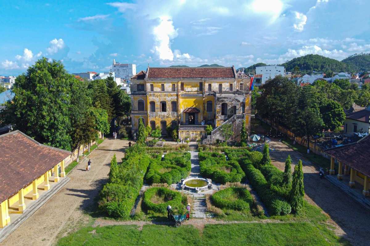 Front View of An Dinh Palace with Statue Pavilion Front view of An Dinh Palace showing statue pavilion surrounded by gardens in Hue