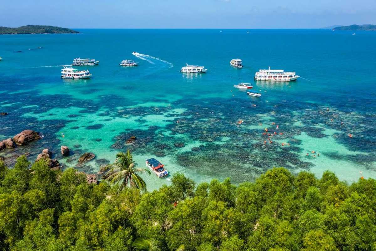 Clear Water Swimming at Gam Ghi Island Phu Quoc Visitors swimming in the crystal-clear waters at a beach on Gam Ghi Island Phu Quoc.