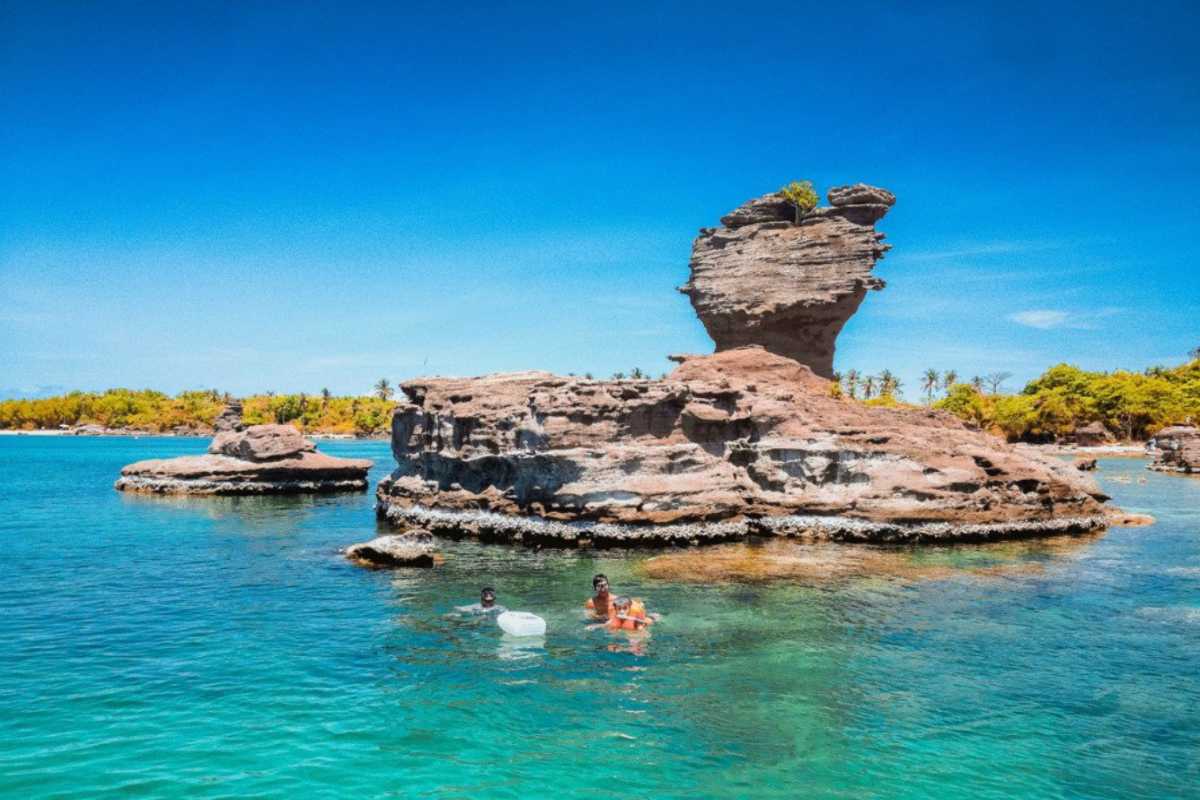 Gam Ghi Island Phu Quoc Rocky Coastline Jagged rocky coastline meeting the clear blue ocean water at Gam Ghi Island Phu Quoc.